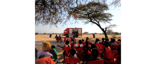 Howell preaching with the Gospel Chariot