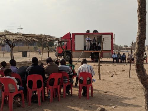 Nathan Ferguson preaching with the Gospel Chariot